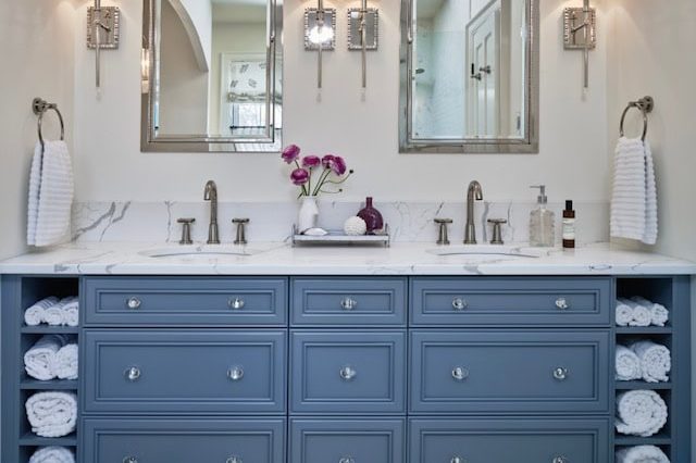 Elegant bathroom with double vanity and mirrors.